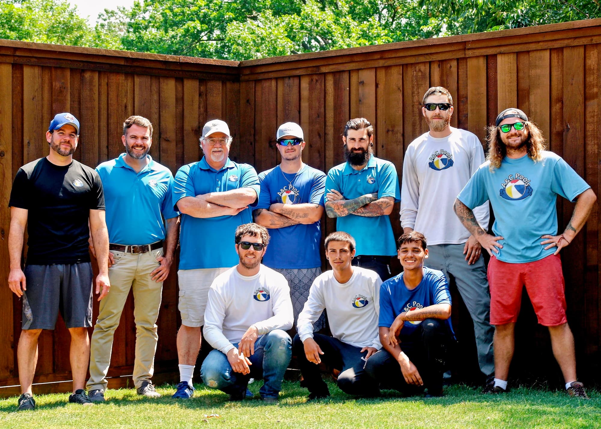 The A&C Pools team gathered outdoors